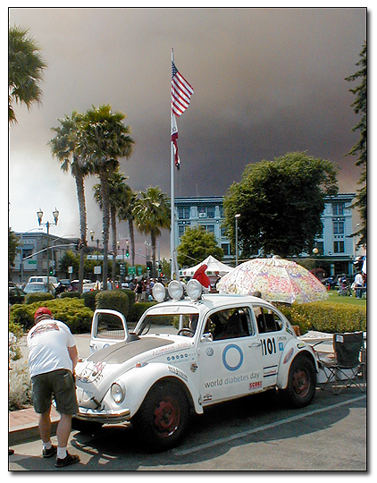 Smoke from the Tabing fire blows over the plaza in Watsonville during the diabetes health fair at the farmer's market